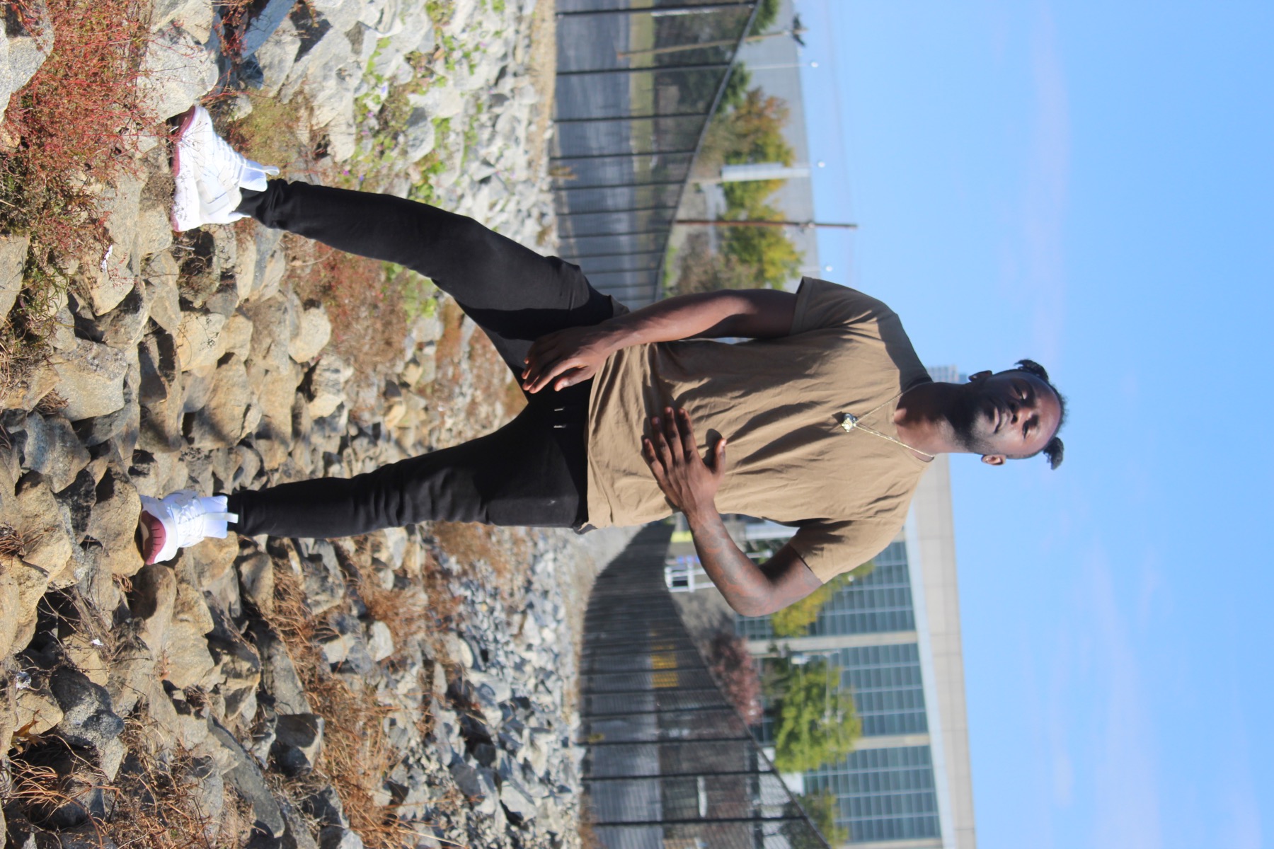 TheIssa standing outdoors